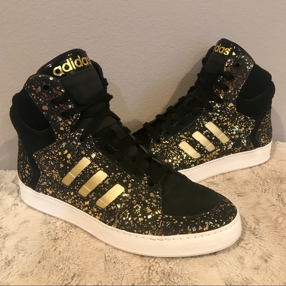 black adidas shoes with gold stripes